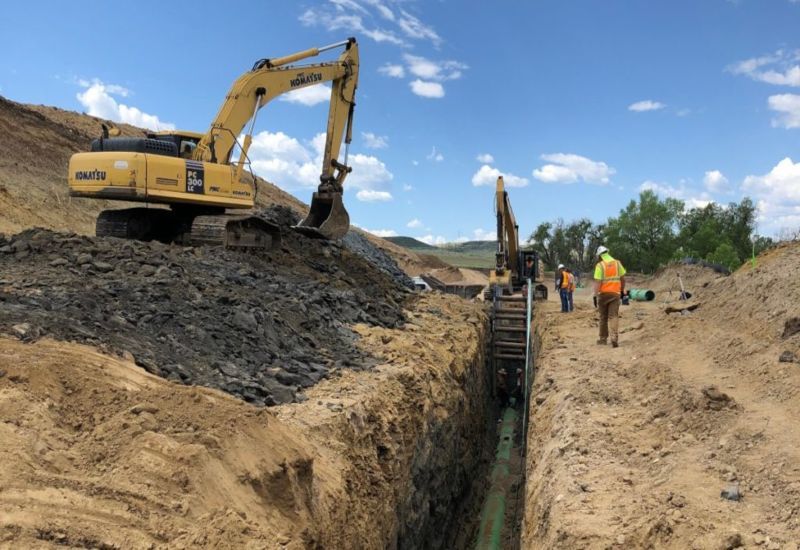Aerial view of completed subdivision with paved roads and foundations
